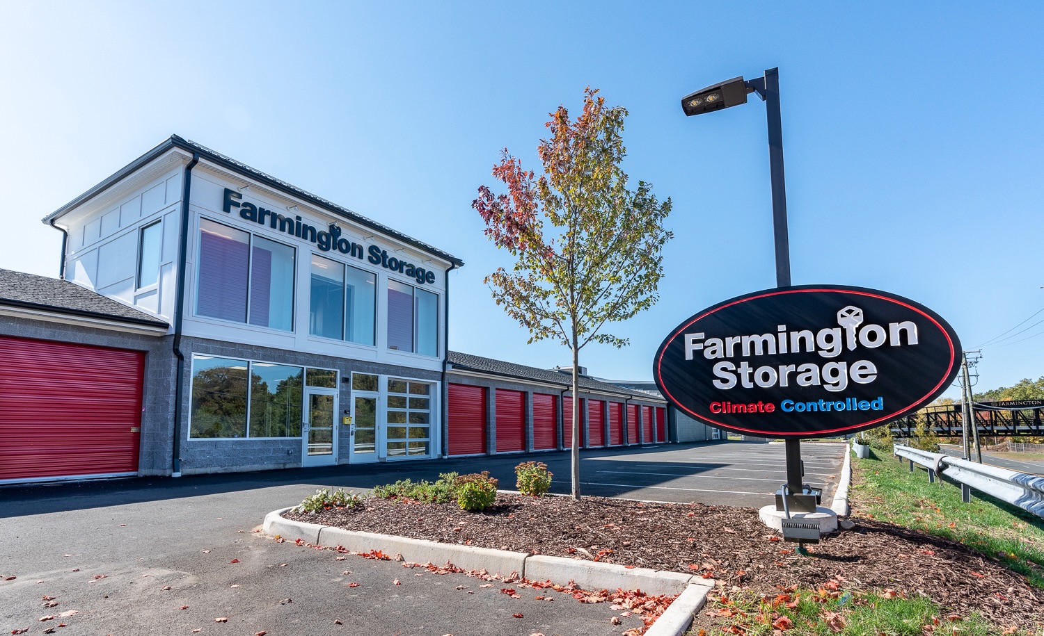 Farmington Storage facility exterior with sign and storage units